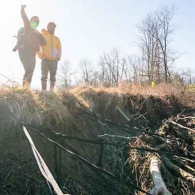 Members of the Voinovich school survey land damage