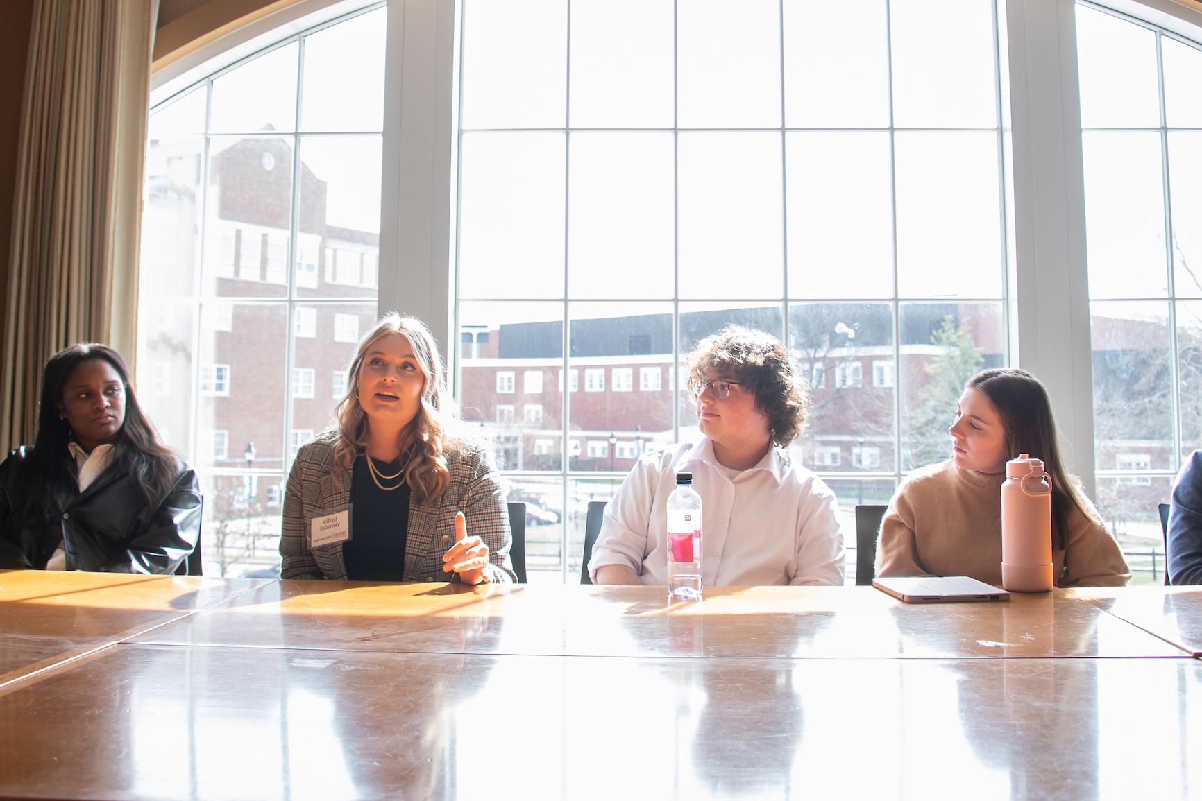 Four Pre-law Students sitting at a table discussing something