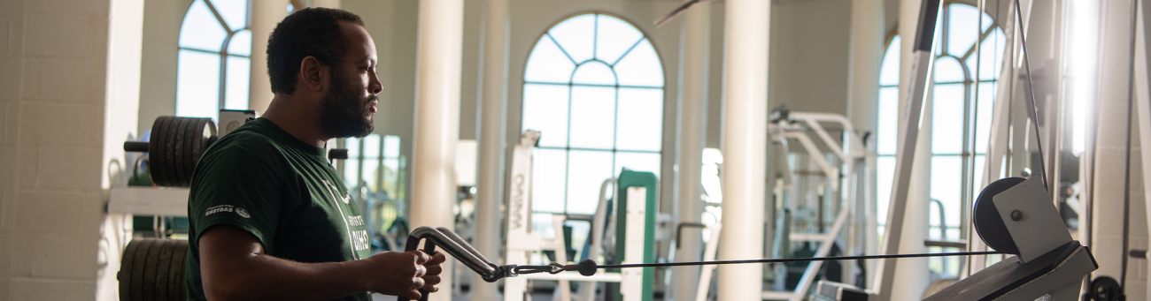 a man uses an exercise machine